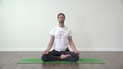 Yoga practice at Yogateket with Guy Powiecki sitting in Padmasana