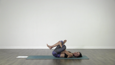 Yogi is practising yoga on a blue yoga mat on white background