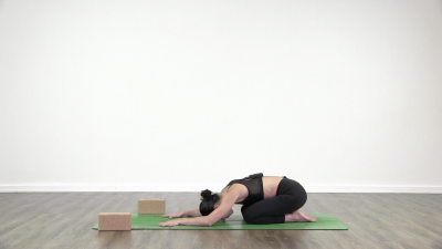 Yogi is practising yoga on a blue yoga mat on white background
