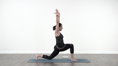 Yoga teacher performing yoga posture on green yoga mat on white background