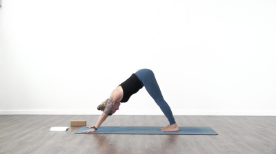 Yogi is practising yoga on a blue yoga mat on white background