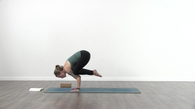 Yogi is practising yoga on a blue yoga mat on white background