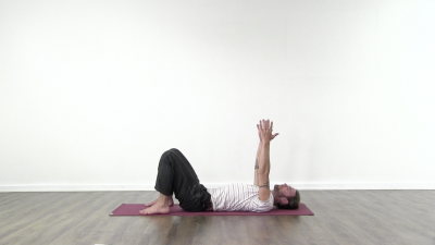 Yogi is practising yoga on a blue yoga mat on white background