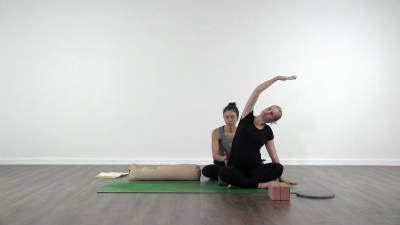 Yogi is practising yoga on a blue yoga mat on white background